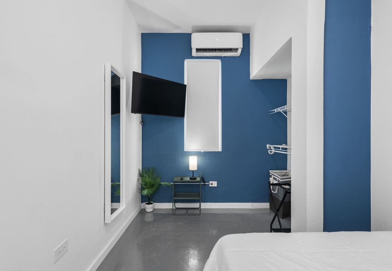 Split A/C and wall-mounted TV in bedroom 1