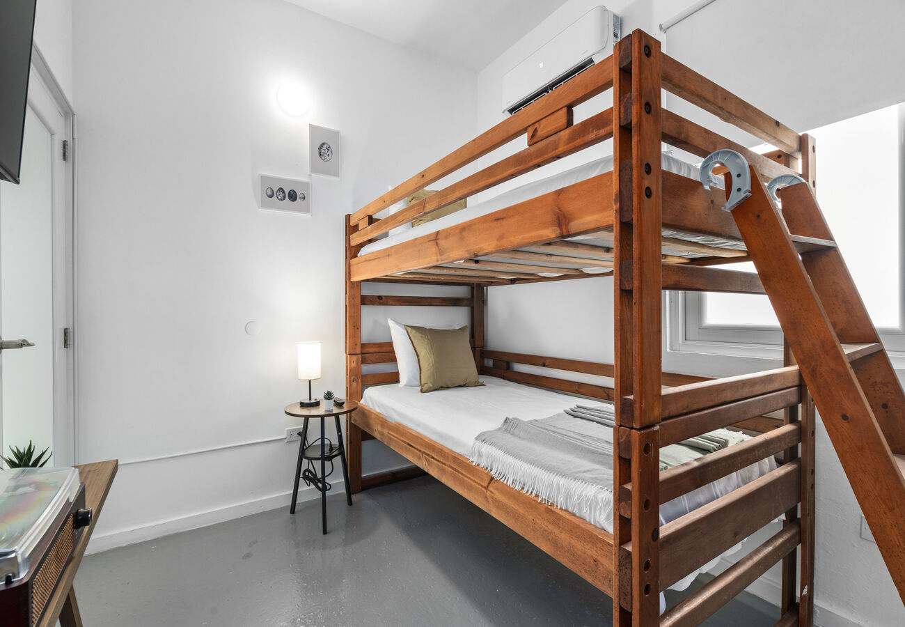 Twin-over-twin bunk beds with reading lamp