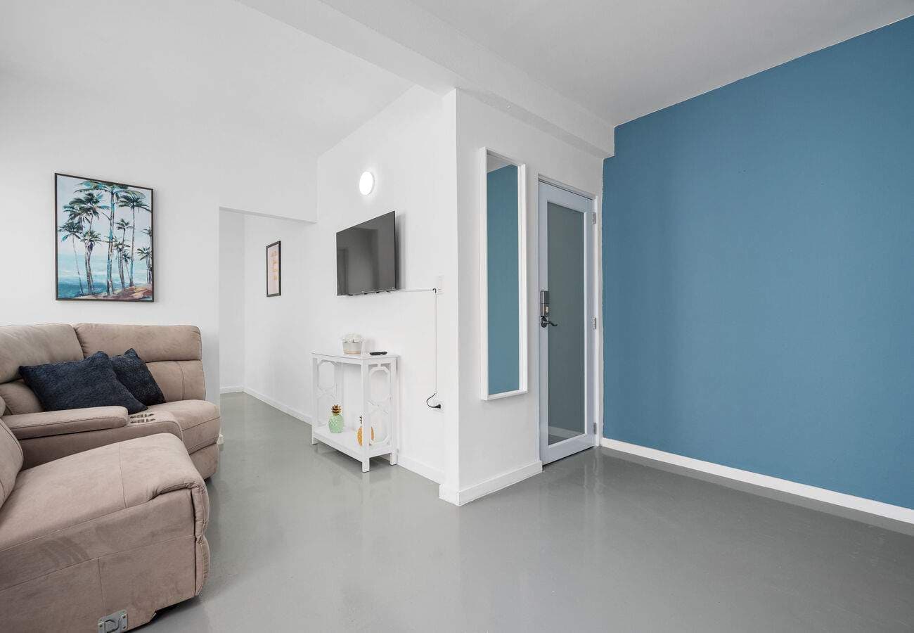 Open living area with blue accent wall