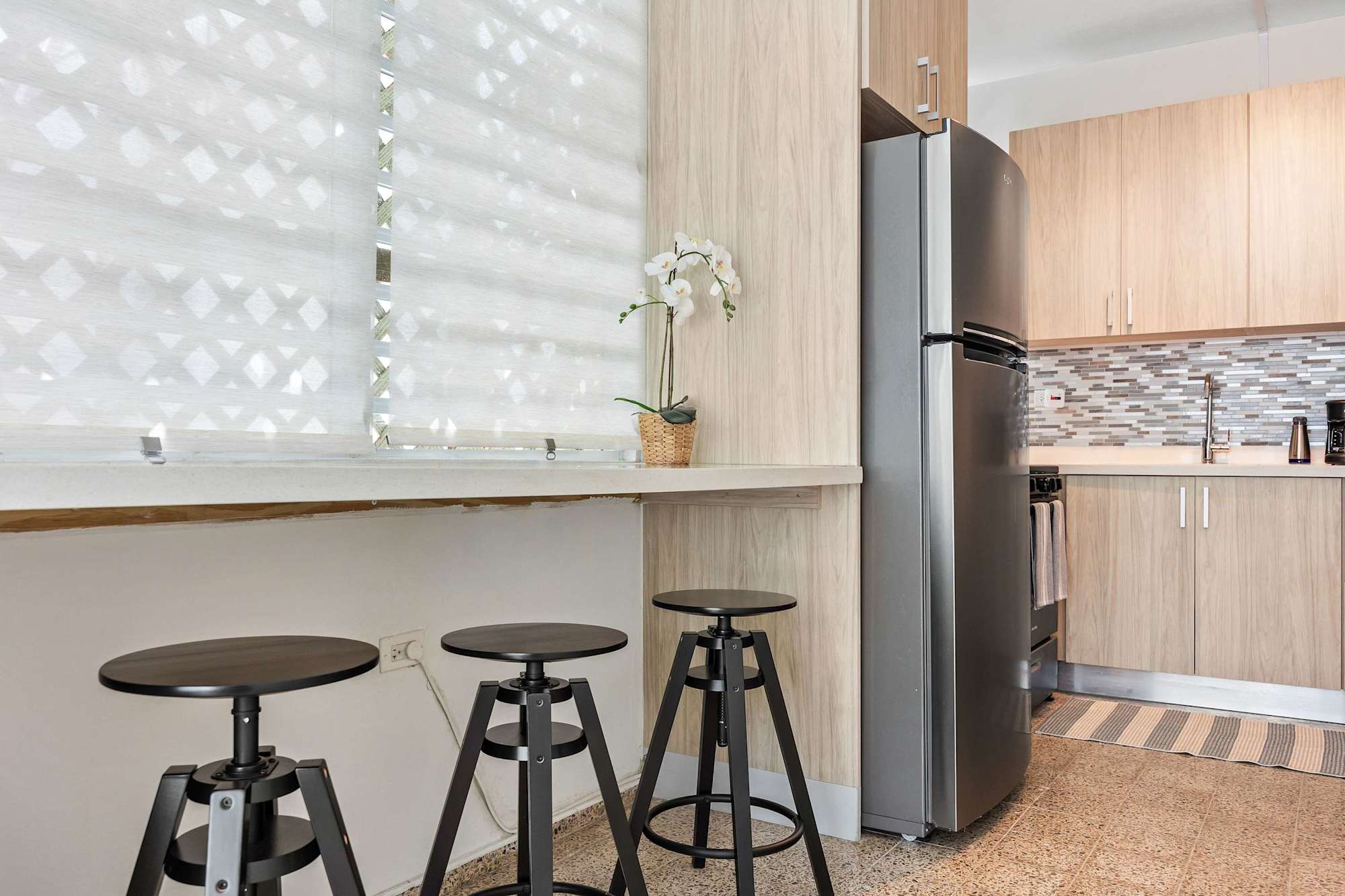 Breakfast bar with three stools