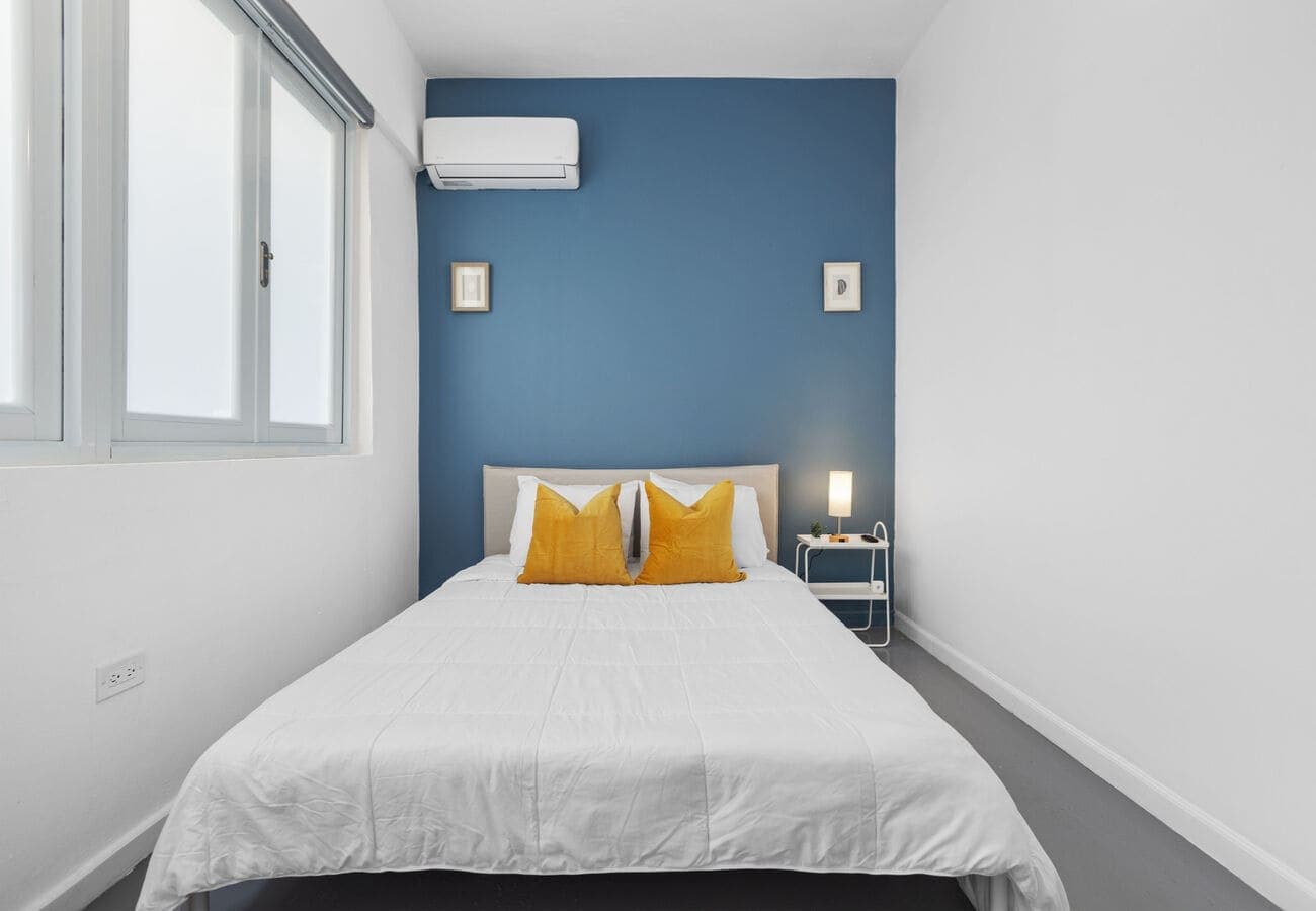 Second queen bedroom with A/C and crisp hotel-style linens