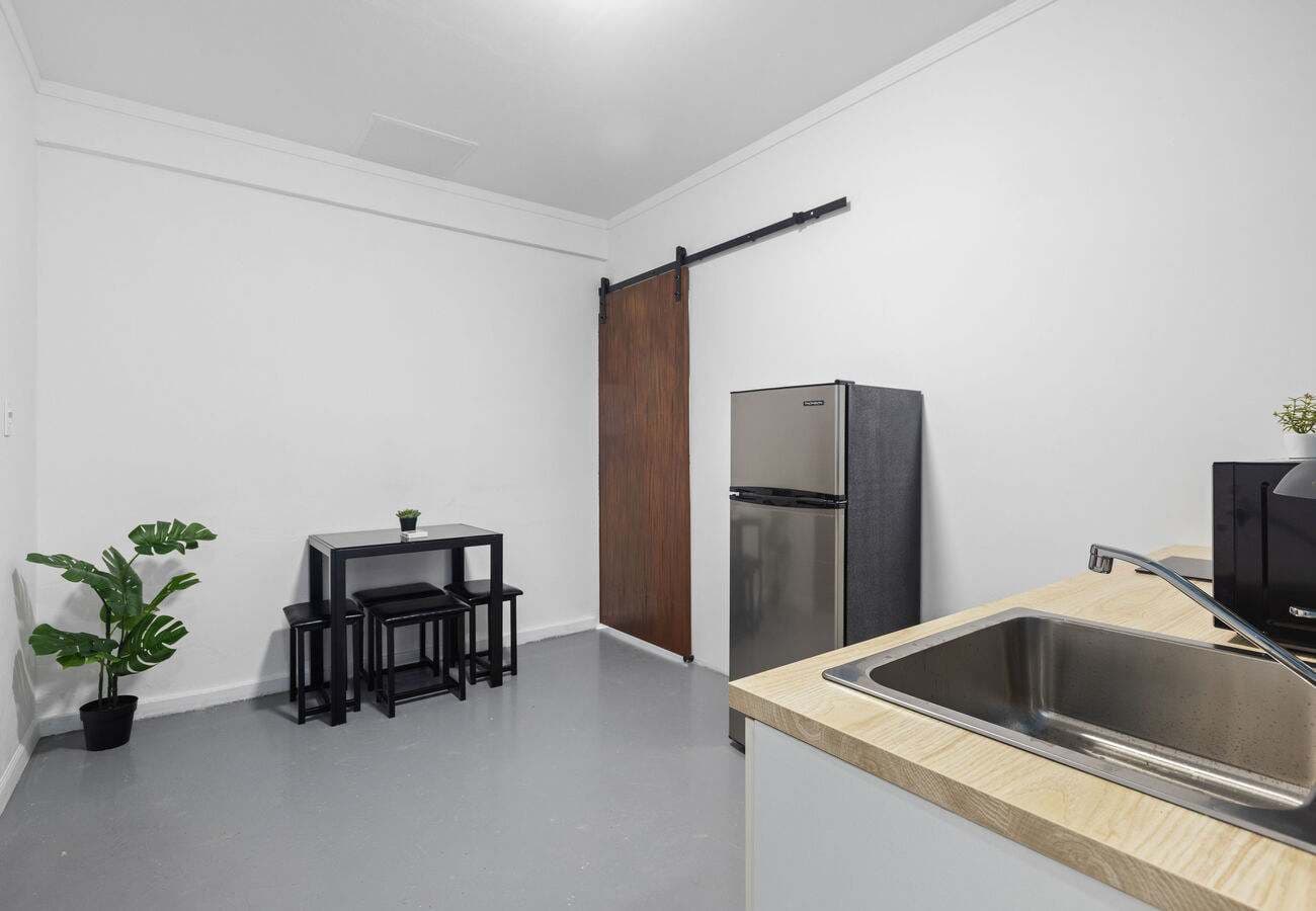 Dining nook with seating for four and full-size fridge