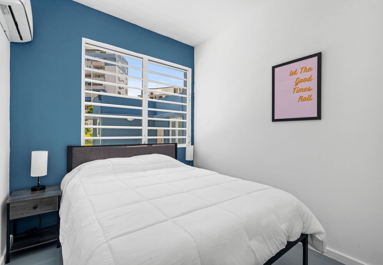 Queen bedroom with split A/C & art