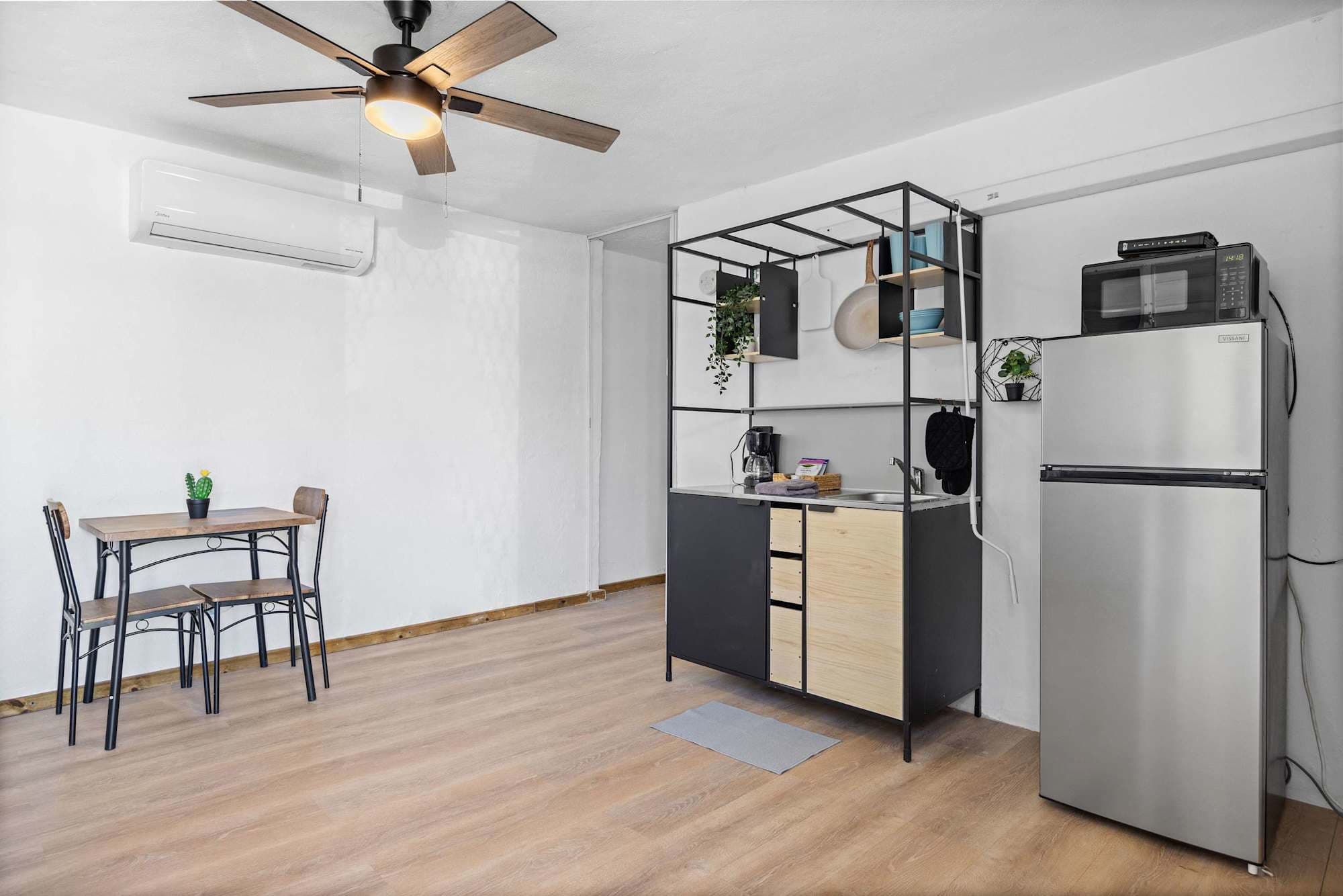 Kitchenette with full-size fridge & dining for two