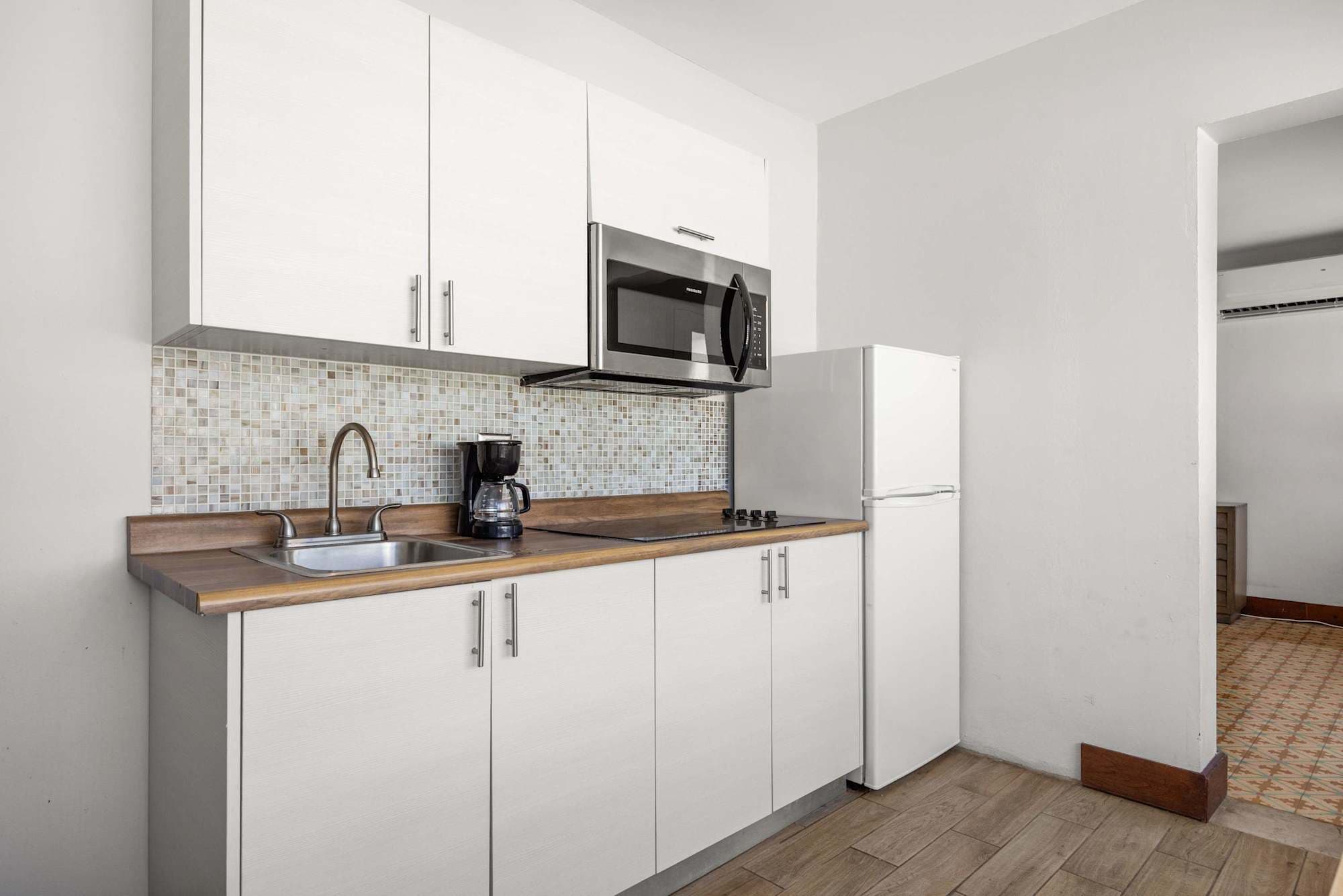White cabinets and microwave view