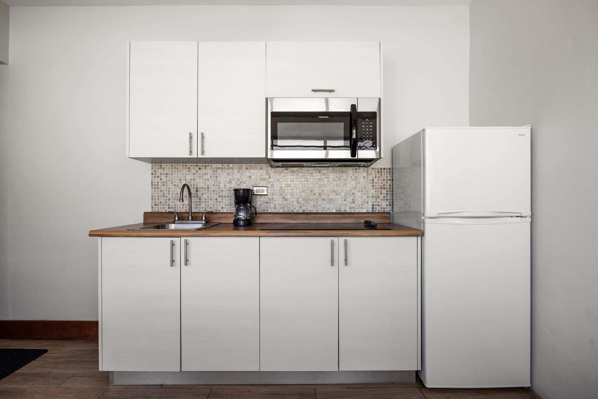 Clean kitchen and white fridge