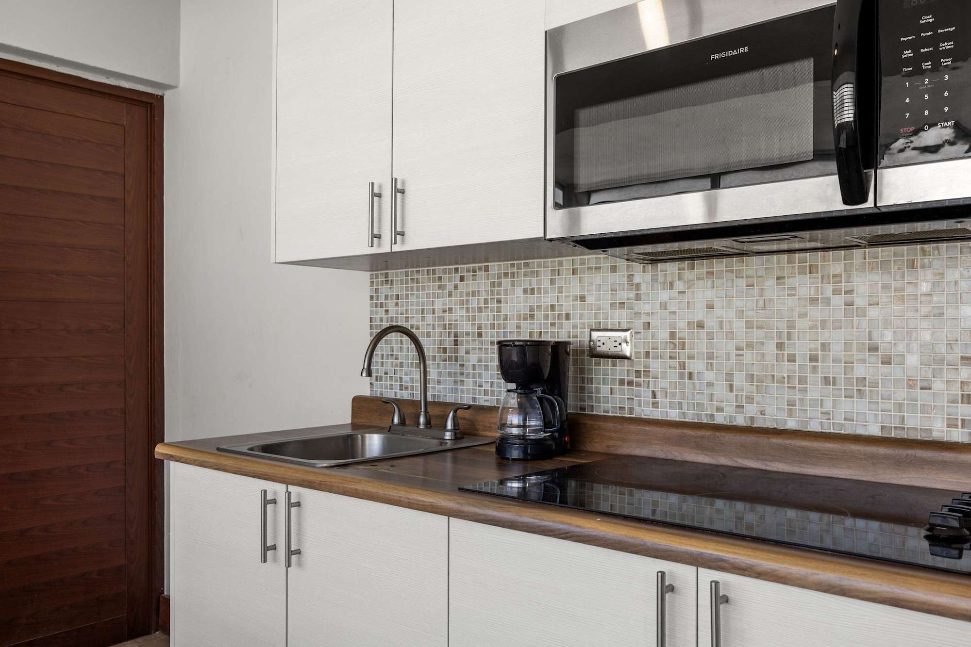 Kitchen sink and mosaic tiles