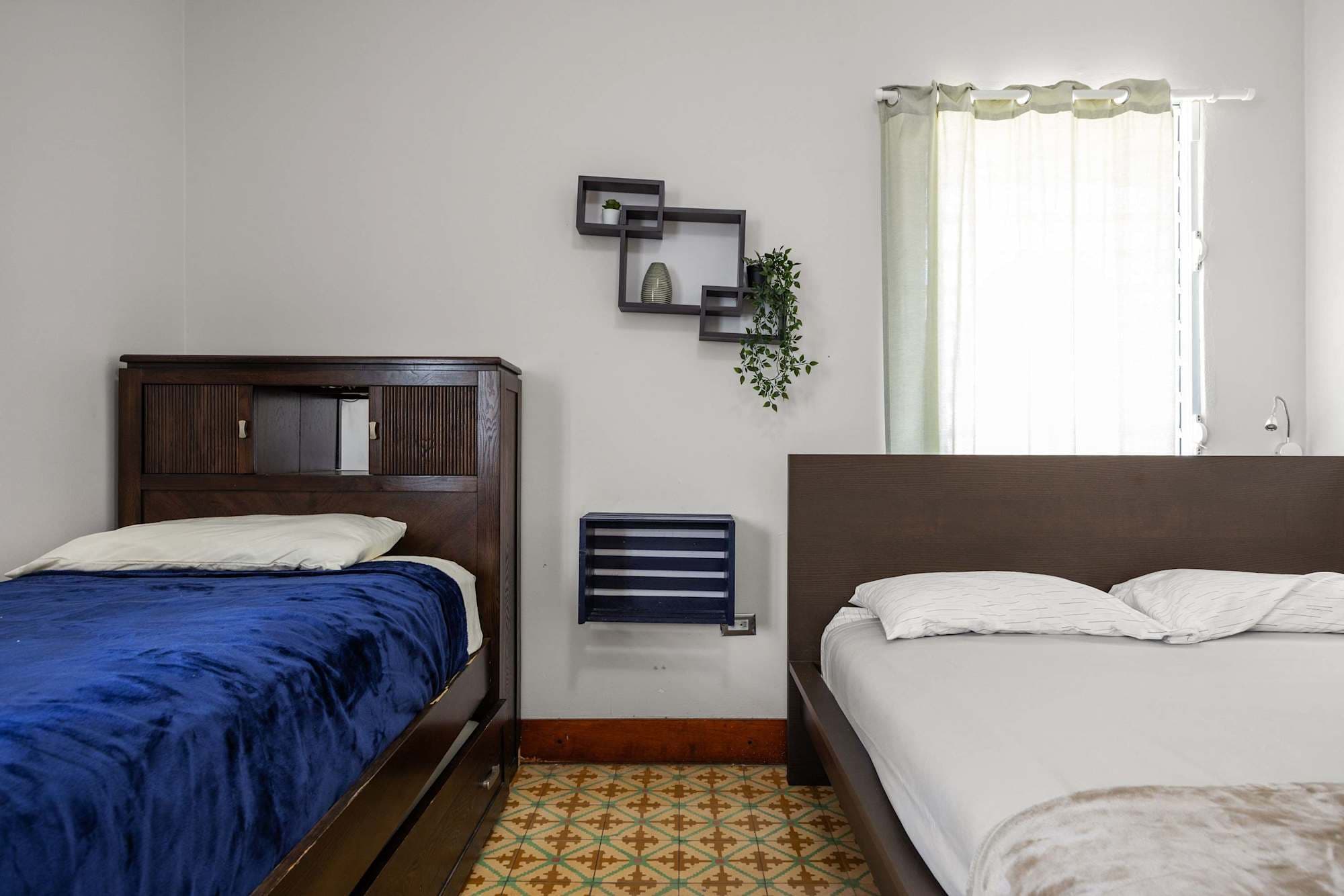 Two beds with linens