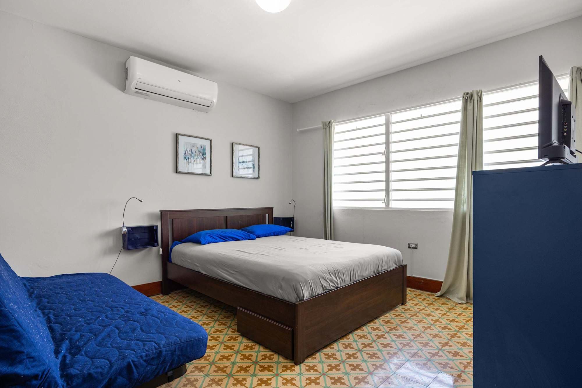 Bedroom with large blue bed