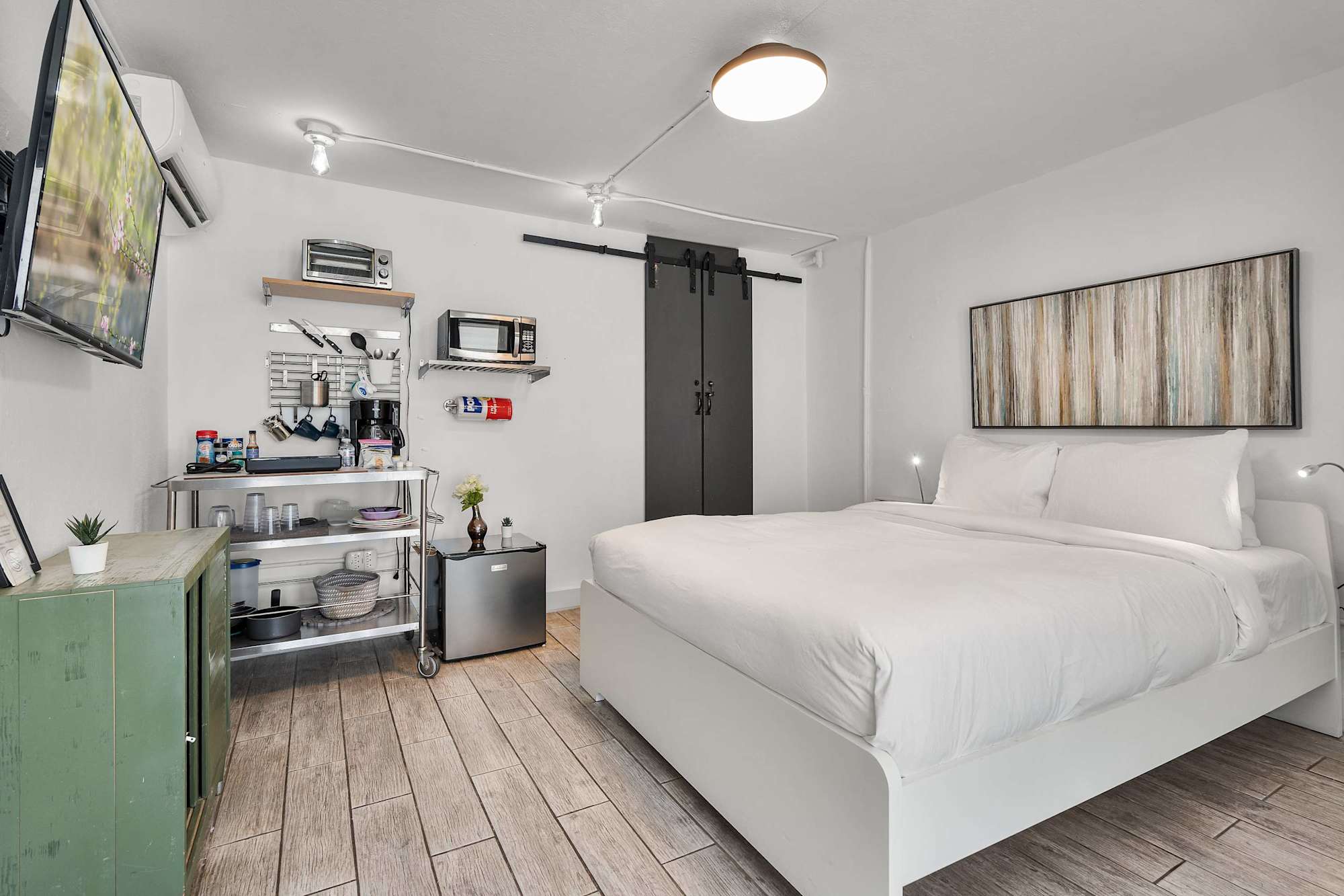 Rest easy with dedicated bedside reading lights and built-in shelving. Every detail is curated to offer a peaceful, clutter-free retreat.